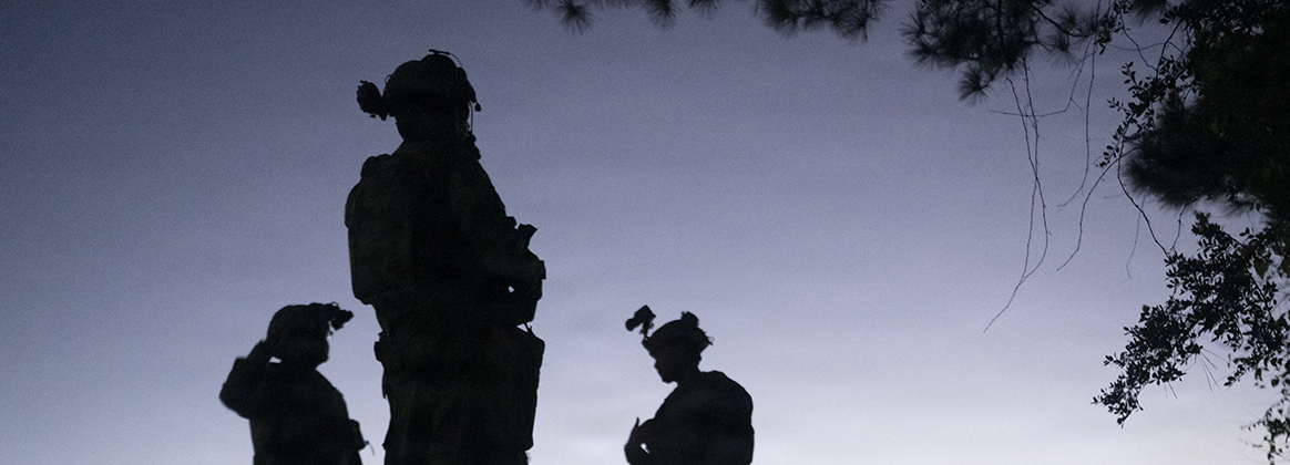 A photo of three Airmen participating in an exercise.